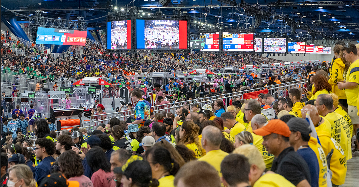 FIRST Tech Challenge World Championship arena with crowd, competition field, and FIRST banners